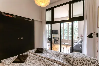 a bedroom with a bed and a large window at #7 What else ? Your own quiet terrace in Nice center 10min to Beach in Nice