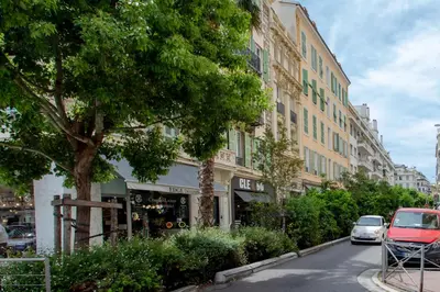 a street with cars parked in front of a building at #28 1 BDR Flat AC Balcony Hper Central 10mins to Beach & old town in Nice