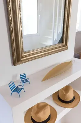 a mirror and two chairs and two hats on a shelf at #32 Panoramic Sea View over Old Town Terrace & AC in Nice