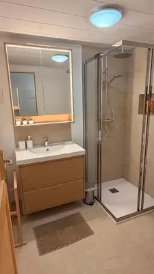 a bathroom with a sink and a shower with a mirror at Very cosy flat in heart of Old Town of Nice near beach in Nice