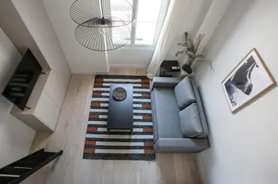 an overhead view of a living room with a couch at Studio Francilia - Welkeys in Nice