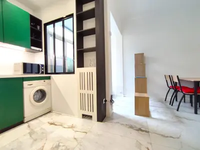 a kitchen with a washer and dryer in a room at GARDEN LEVEL nearby beach in Nice