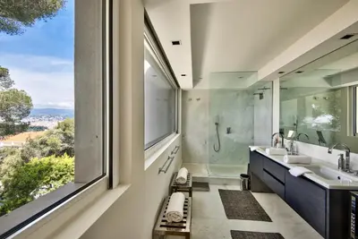 a bathroom with two sinks and a large window at Villa Mont Boron, vue mer exceptionnelle in Nice