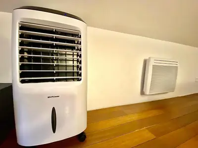 a white heater sitting on the floor next to a wall at Lovely & cozy duplex heart of Nice with bathtub! in Nice