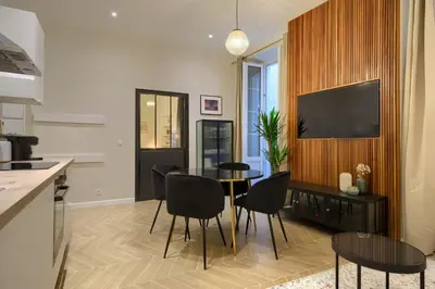 a kitchen and dining room with a table and chairs at CASA ALMA. Hyper Centre. Luxe. in Nice
