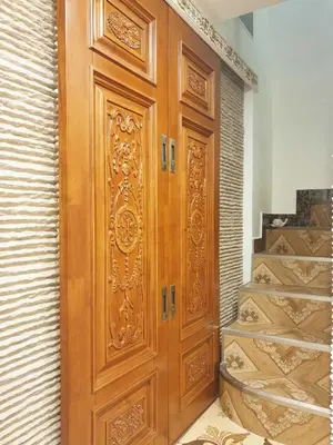 a large wooden door in a room with stairs at LOFT LUXE et GLAMOUR ! NICE CENTRE. in Nice
