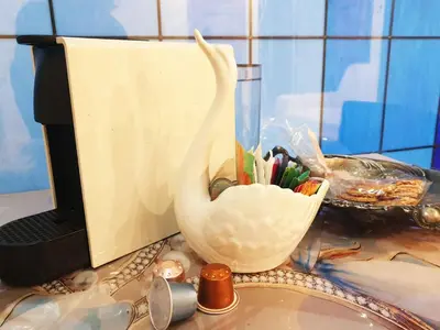 a statue of a swan on a desk next to a computer at LOFT LUXE et GLAMOUR ! NICE CENTRE. in Nice