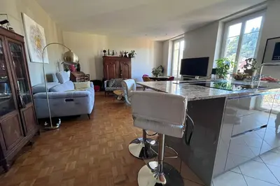 a table and chairs on a balcony with a view at Beautiful 85m near the historic center in Nice