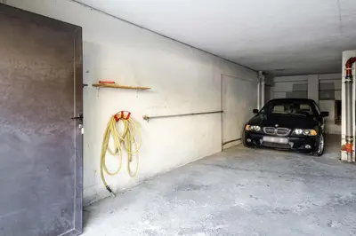 a garage with a car parked in it at Market Square 2 bedrooms 2 baths AC private garage in Beaulieu-sur-Mer
