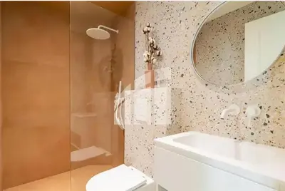 a bathroom with a toilet and a sink and a mirror at 2 pièces vieux Nice vue coulée verte in Nice