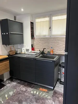 a kitchen with a sink and a counter top at Appart Nice Marguerite in Nice