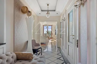 a living room with a hallway with a door at Luxury apartment with sea view on the first line Promenade des Anglais in Nice