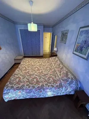 a bedroom with a large bed in a room at Appartamento con vista Promenade in Nice