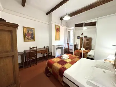 a hotel room with two beds and a desk at ApartHotel Riviera - BARILLERIE 3 - Vieille Ville 50m de la plage- 4 pieces - AC in Nice