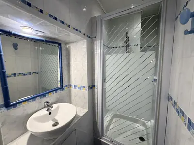 a bathroom with a sink and a glass shower at ApartHotel Riviera - BARILLERIE 3 - Vieille Ville 50m de la plage- 4 pieces - AC in Nice