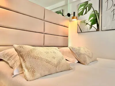 a bedroom with a bed with two pillows on it at DUPLEX LE GESÙ - VIEILLE VILLE - CLIM - WIFI in Nice