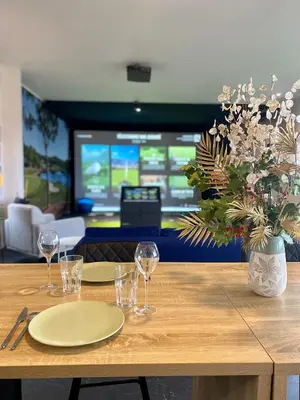 a living room with a blue couch and a table at STAYnGOLF in Cagnes-sur-Mer