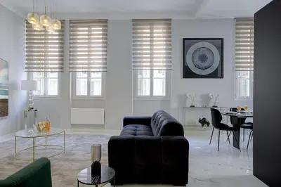 a living room with a couch and a table at Maison Bianchi - Clemenceau in Nice