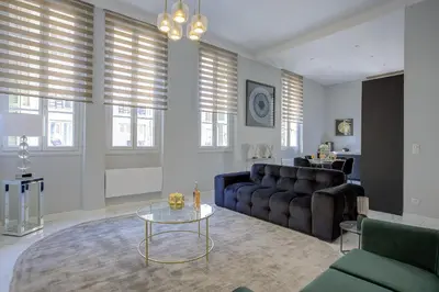 a living room with a couch and a table at Maison Bianchi - Clemenceau in Nice