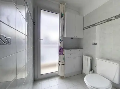 a white bathroom with a toilet and a window at Nestor&Jeeves - VANINA - Central - Close sea in Nice