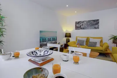 a living room with a table with food on it at Maison Bianchi - Saint Philippe in Nice