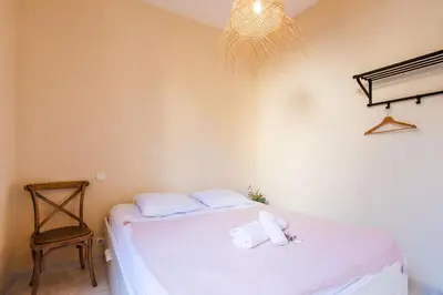 a bedroom with a bed with two towels on it at LE FLORIDA AP4340 By Riviera Holiday Homes in Villefranche-sur-Mer