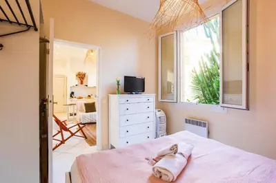 a bedroom with a bed with a towel on it at LE FLORIDA AP4340 By Riviera Holiday Homes in Villefranche-sur-Mer