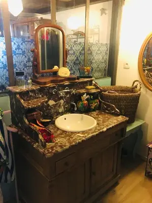 a bathroom with a sink and a mirror at LOFT D ARTISTES AVEC PATIO AU PORT DE NICE in Nice