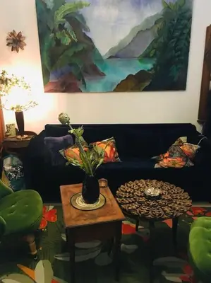 a living room with a couch and a table at LOFT D ARTISTES AVEC PATIO AU PORT DE NICE in Nice