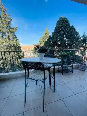 a table and chairs on a balcony with a view at T2 Carre Or Nice Rue Pietonne in Nice