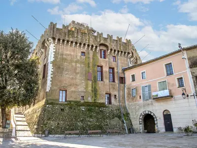 an old building with a wall and benches in front of it at Apartment L'Angelina-2 by Interhome in Cagnes-sur-Mer