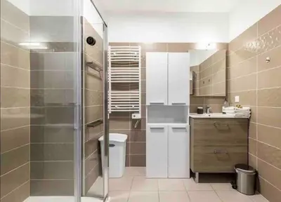 a bathroom with a shower and a toilet and a sink at Q&R Renting - Appartement luxueux et Suites design- Parking AC Mer in Nice