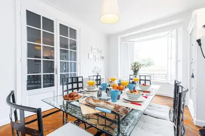 a dining room with a glass table with food on it at MY CASA - JOFFRE 38 - Spacious one bedroom apartment in Nice