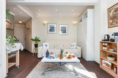 a living room with a couch and a table at MY CASA - STALINGRAD 32 - Cosy Apartement close old Port in Nice