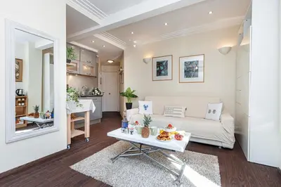 a living room with a white couch and a table at MY CASA - STALINGRAD 32 - Cosy Apartement close old Port in Nice