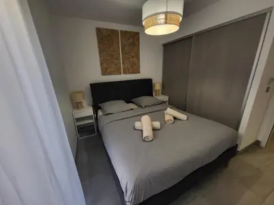 a living room with a table and chairs and a couch at Prestige View 411 By Avecoeur in Èze