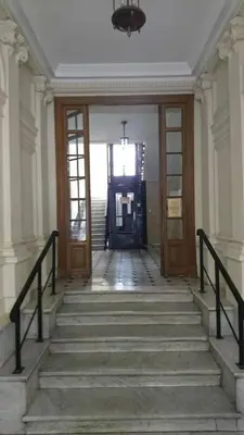 a staircase leading to a door in a building at Lovely Refurbished Apartment in Nice