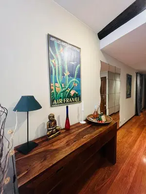 a living room with a large painting on the wall at Vieux Nice 2 pièces Appartement MONACO in Nice