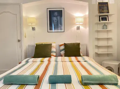 a bedroom with a bed with two pillows on it at Nice Renting - BONAPARTE - Luxury Loft Trendy neighborhood - AC - fully equipped in Nice
