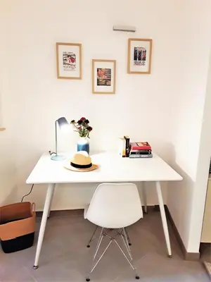 a white desk with a hat on top of it at LA FONTAINE AP4355 By Riviera Holiday Homes in Villefranche-sur-Mer