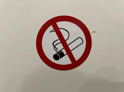 a no smoking sign on a wall at Nice Renting - CAMBRAI02 - Studio Beach Sea View - AC - Promenade des Anglais in Nice