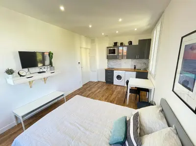 a large bedroom with a bed and a kitchen at Nice Renting - CAMBRAI02 - Studio Beach Sea View - AC - Promenade des Anglais in Nice