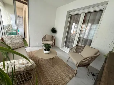a living room with a couch and chairs and a table at Superbe appartement avec piscine l'été de juin à septembre in Nice