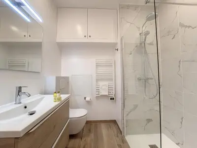 a bathroom with a shower and a toilet and a sink at Nestor&Jeeves - LE NICOIS - Central in Nice