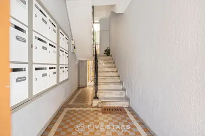 a hallway with a staircase with a tiled floor at Suite La bohème Five stars Holiday house in Nice