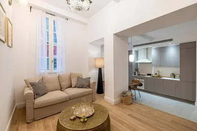 a living room with a couch and a table at Chez Collette - Luxury in the Old Nice in Nice
