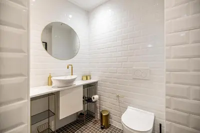 a bathroom with a sink and a toilet and a mirror at Chez Collette - Luxury in the Old Nice in Nice