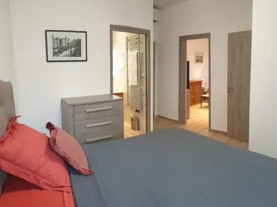 a bedroom with a bed and a dresser and a mirror at LA MAÏOUN DI JOSE - Appt 2 pièces nice centre cœur marché de la libération in Nice