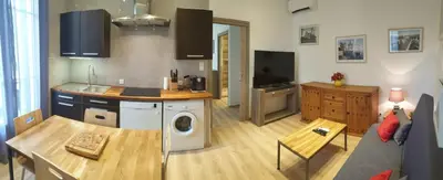 a kitchen and living room with a washing machine at LA MAÏOUN DI JOSE - Appt 2 pièces nice centre cœur marché de la libération in Nice