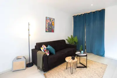 a living room with a couch and a table at L5 2mins Walk to the Beach Heart of Old Town Nice in Nice